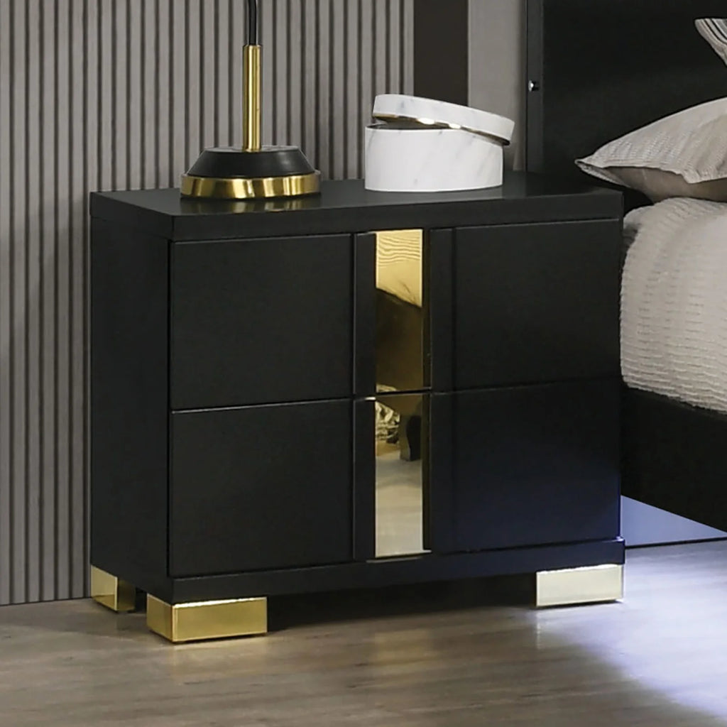 Stylish black and gold nightstand from modern king bedroom set with LED lighting in a contemporary bedroom.