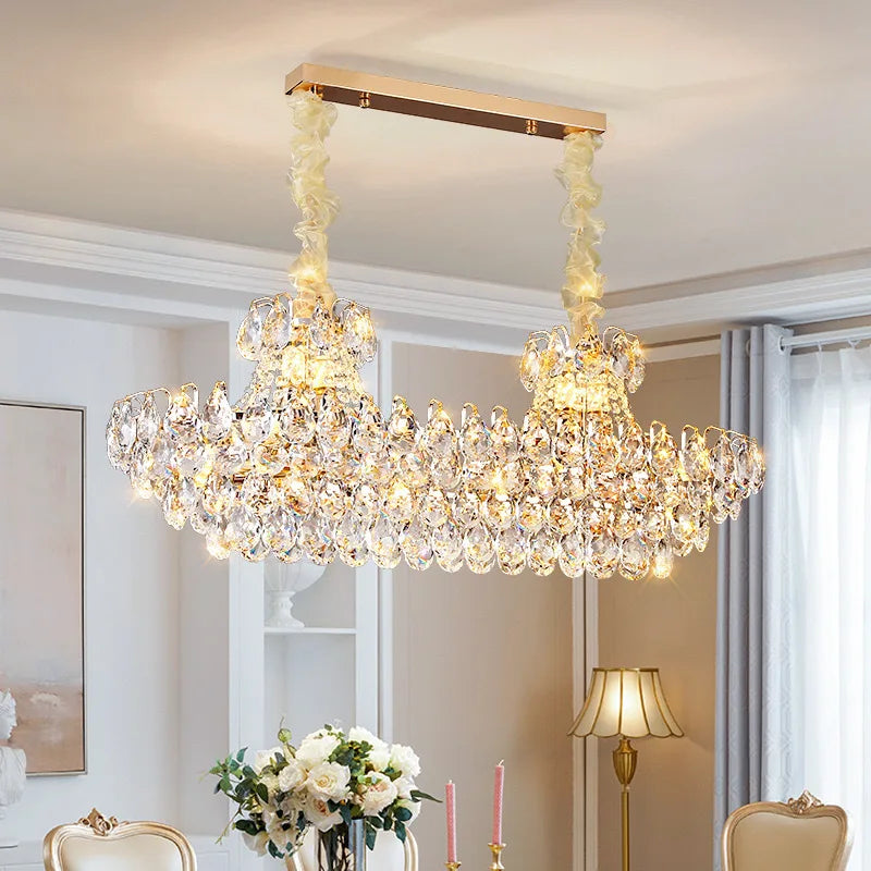 Luxury crystal chandelier illuminating a stylish living room with elegant design and shimmering crystals.
