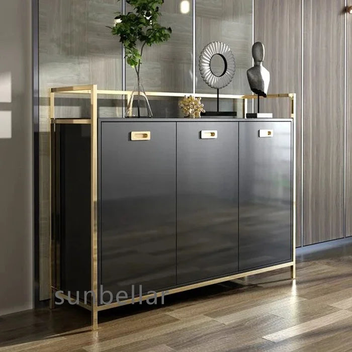 Gold stainless steel console cabinet with tempered glass top and black drawers, perfect for stylish entryway decor.