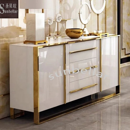 Modern kitchen cabinet with white finish and gold accents