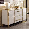 Modern kitchen cabinet with white finish and gold accents