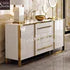 Modern kitchen cabinet with white finish and gold accents