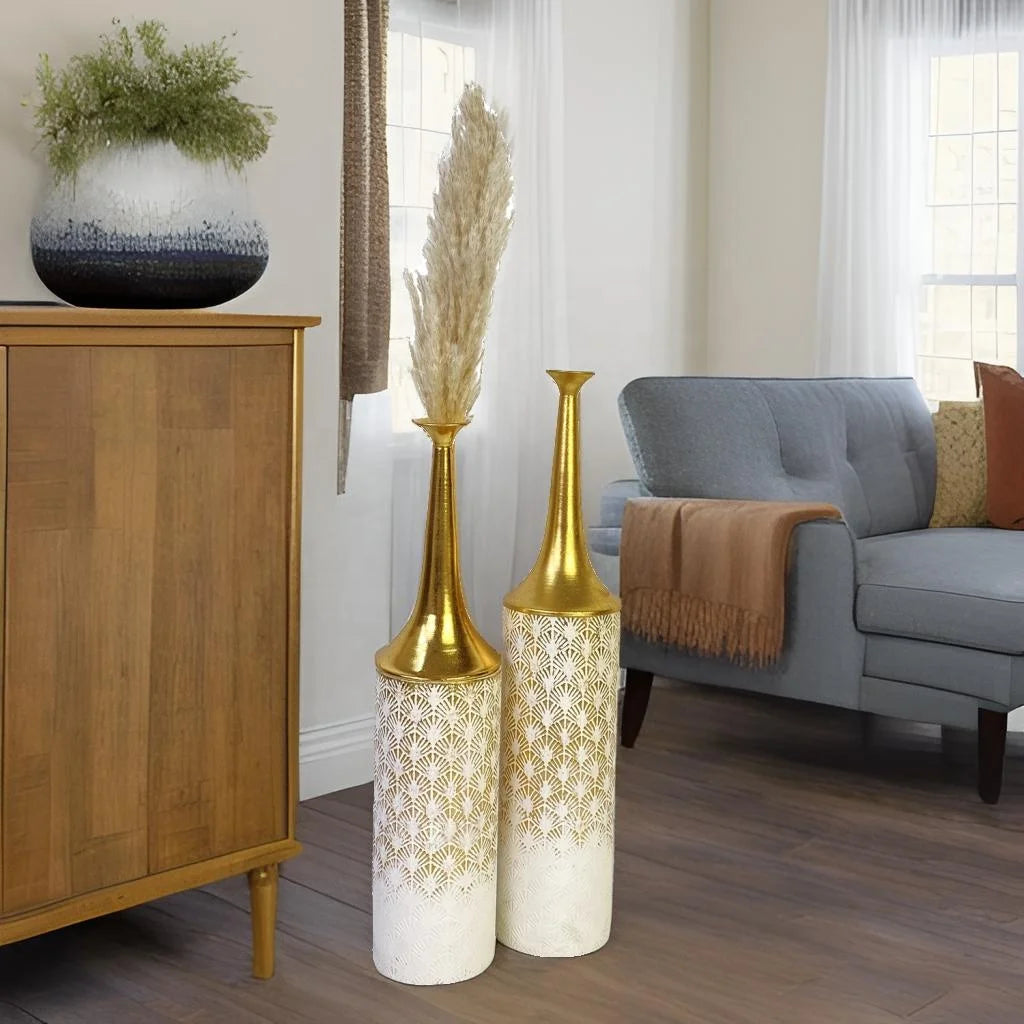 Set of 2 rustic tall metal floor vases in vintage gold finish, showcasing luxury and beautiful statement pieces in a cozy living room.