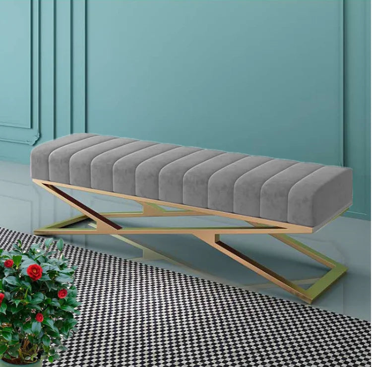 Modern tufted velvet bench with a stainless steel base, perfect for living room and bedroom decor.