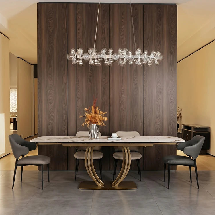 extendable sintered stone dining table with metal frame and stylish chairs in modern dining room