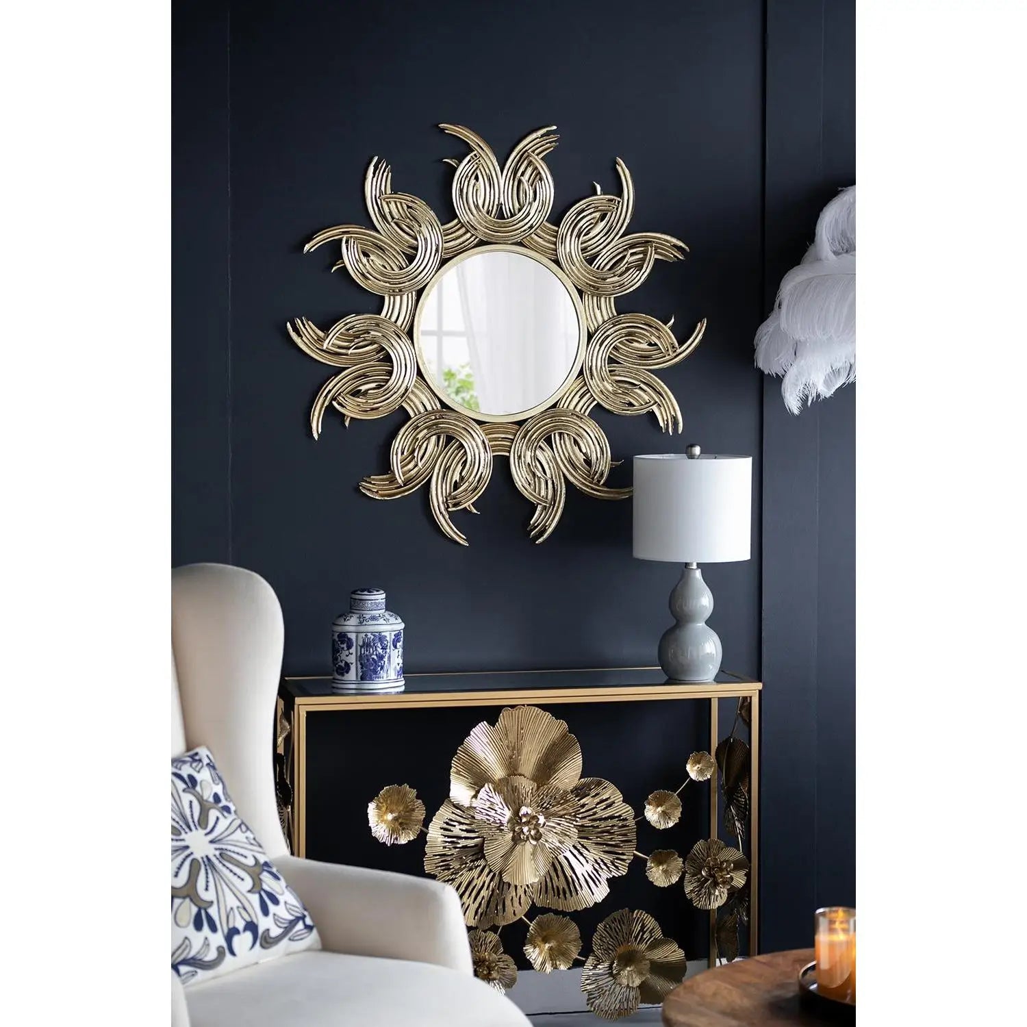Decorative wall mirror with floral design in a living room setting.