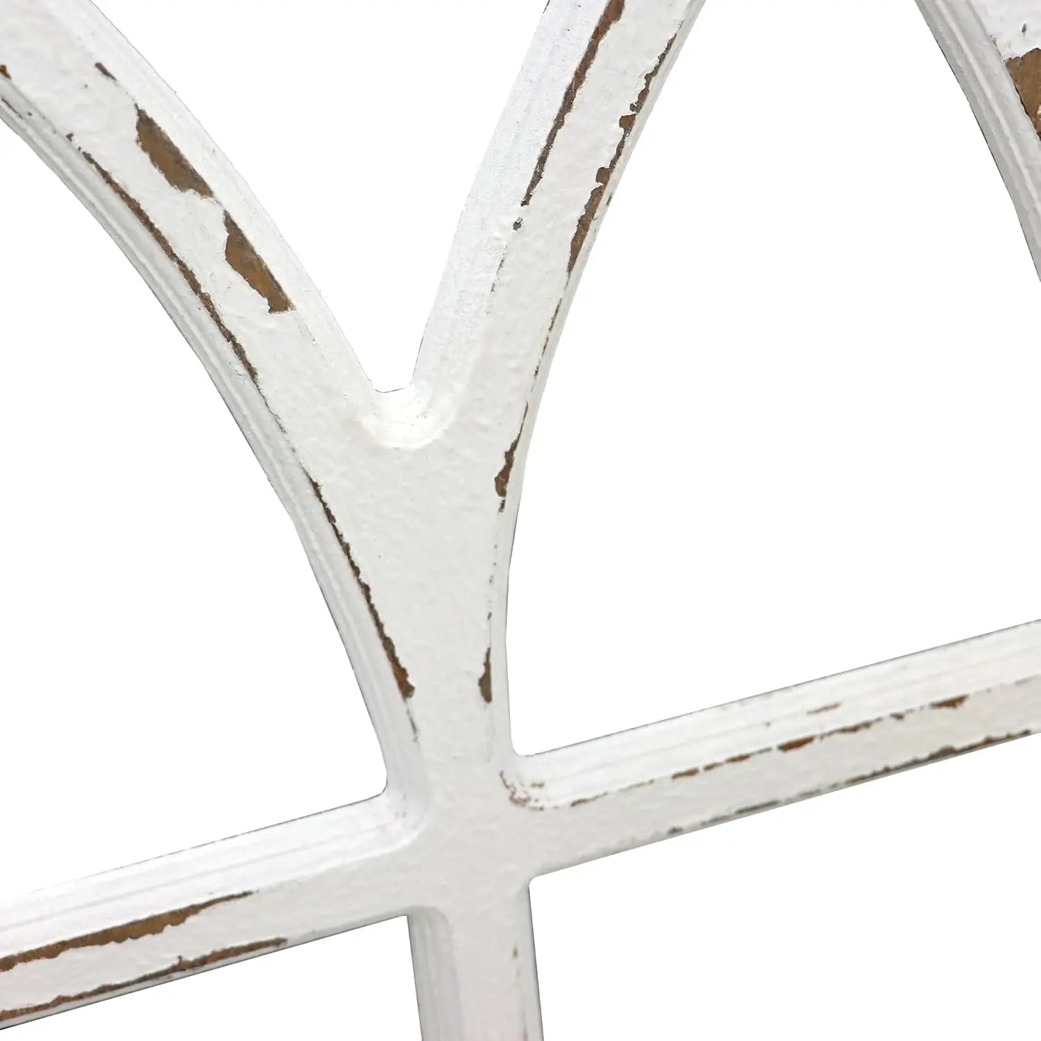 Close-up of a white decorative window frame with a rustic finish on a white background