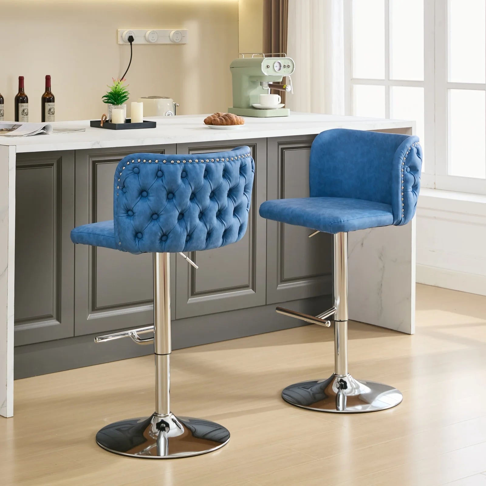 Set of 2 Leather Swivel Adjustable Bar Stools in blue with tufted design and chrome base for modern kitchen décor.