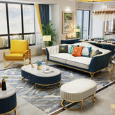 Modern living room with blue and white sofa, yellow armchair, and marble coffee table.