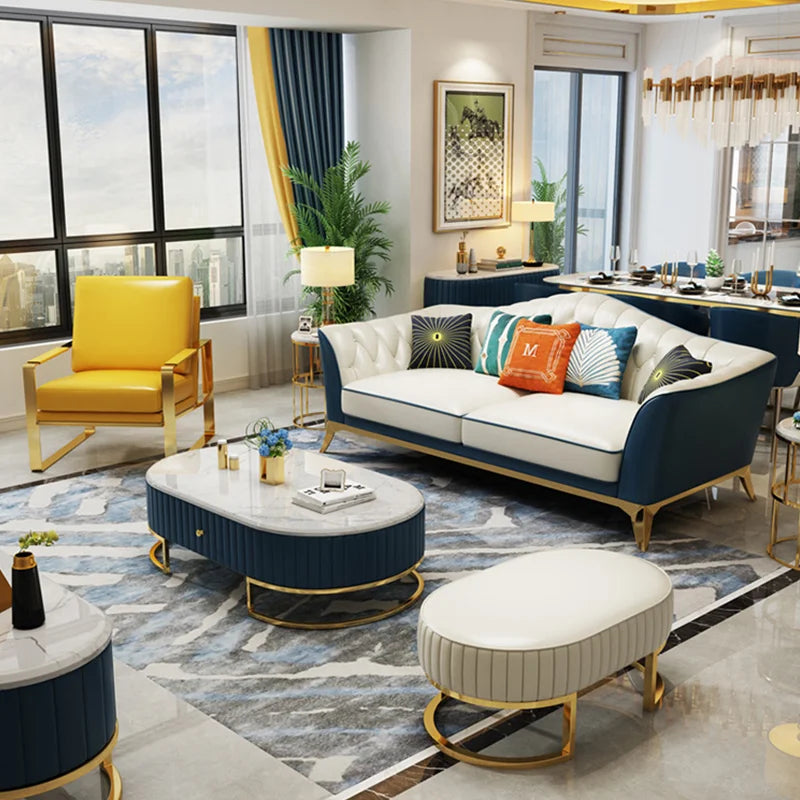 Tufted leather modular sofa set in a stylish living room with gold stainless steel legs and modern decor.