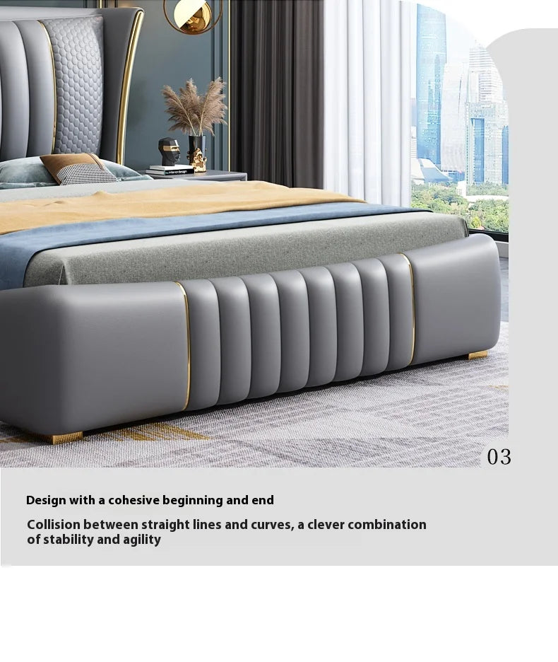 Gray upholstered bed with gold accents in a modern bedroom setting