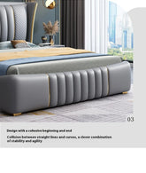 Gray upholstered bed with gold accents in a modern bedroom setting
