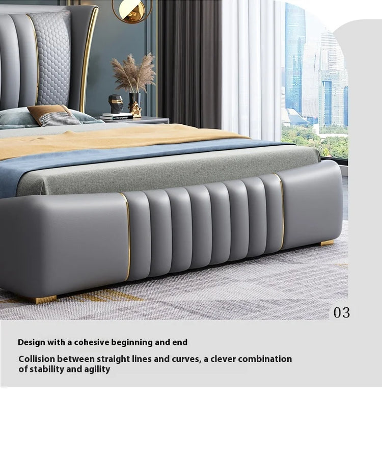 Gray upholstered bed with gold accents in a modern bedroom setting