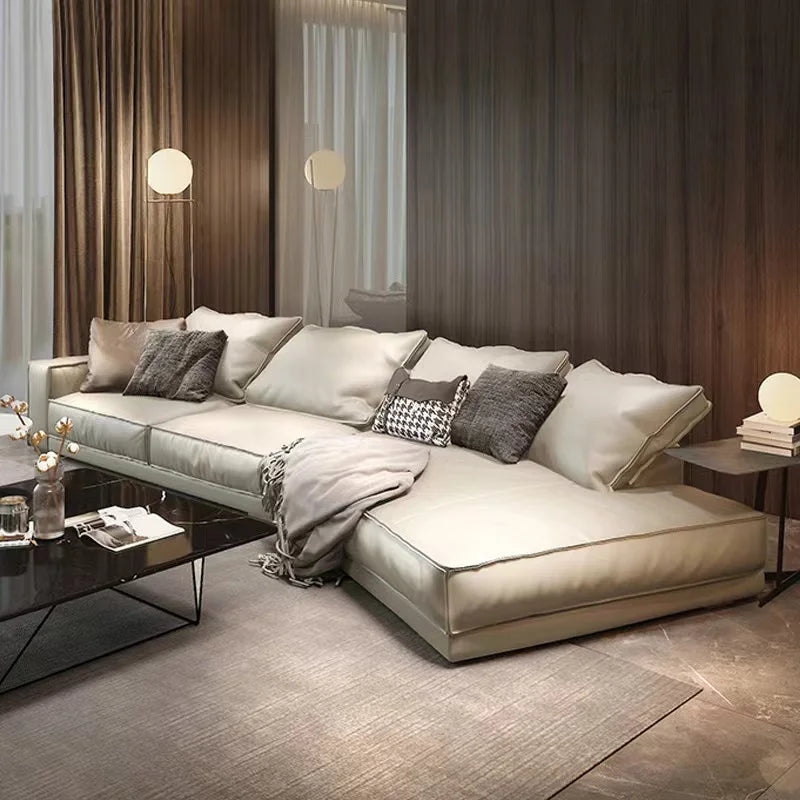 Italian minimalist leather sectional sofa in a modern living room setting with elegant decor.