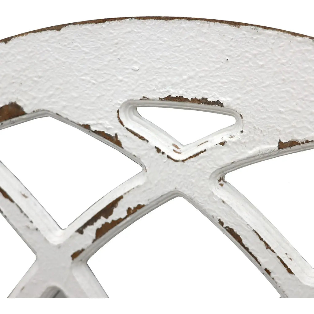 Close-up of a white metal wheel with brown accents on a white background