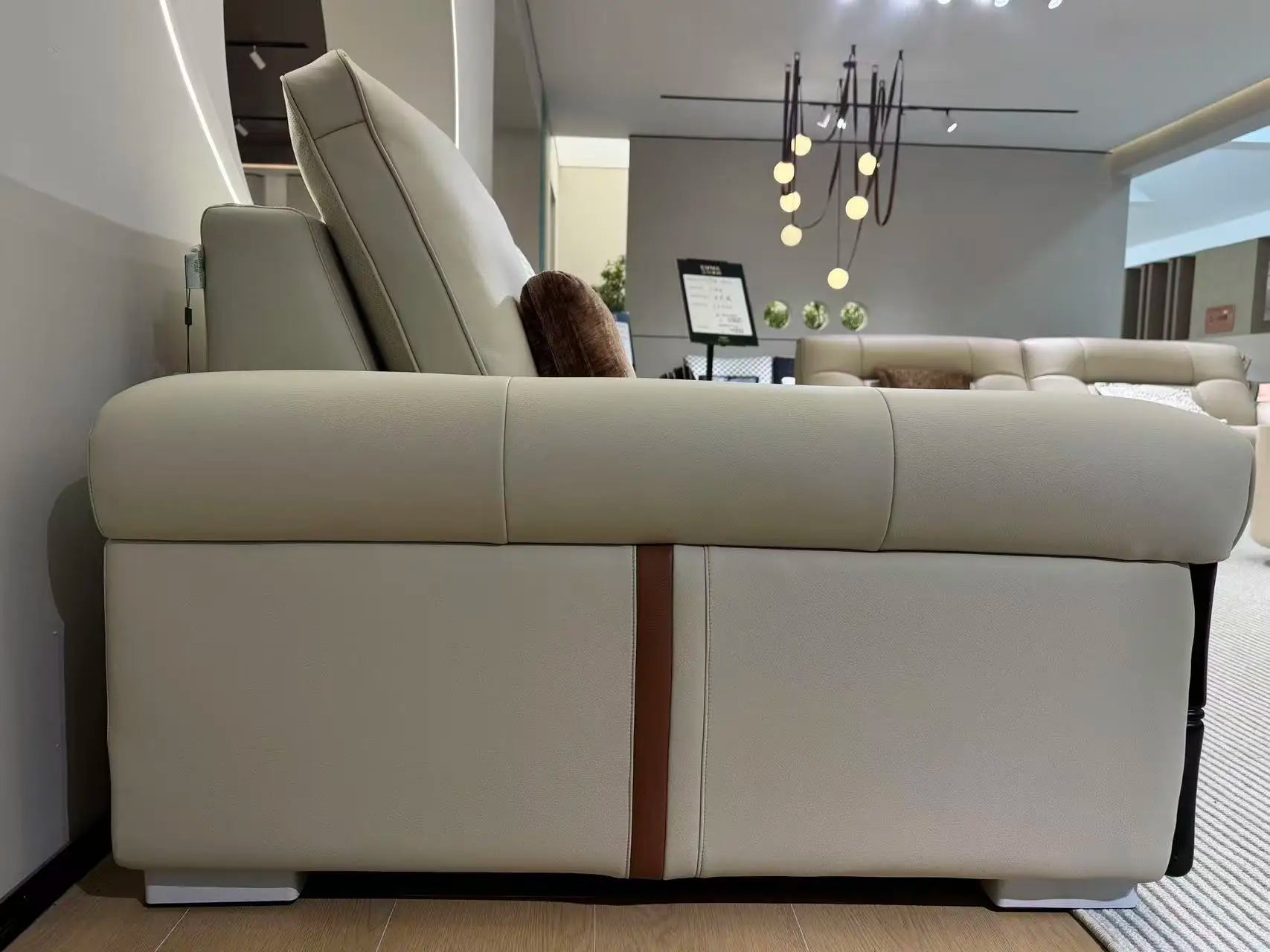 A side view of the customizable luxury modular sectional sofa in eco-leather with cloud cushioning, showcasing its elegant design.