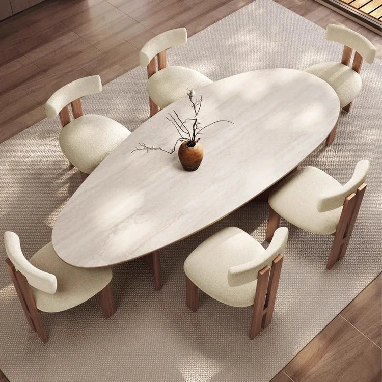 Dining table set with chairs on a wooden floor