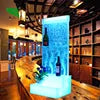Acrylic water bubble bar cabinet with 16 color LED lights and three shelves, showcasing bottles in a stylish interior.