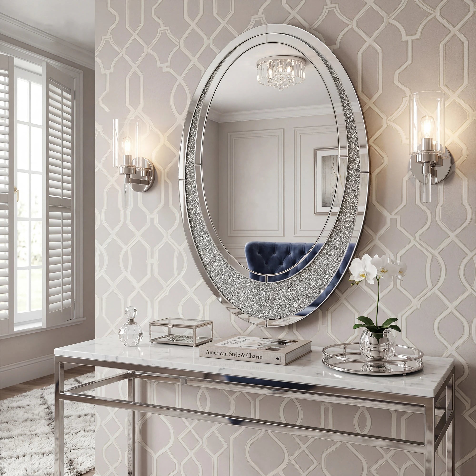 Decorative round mirror with embellishments on a marble console table against a patterned wall.