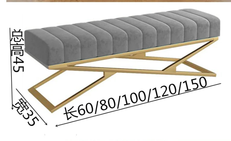 Modern tufted velvet bench with gold legs and plush grey upholstery, featuring elegant tufted design and sleek lines.