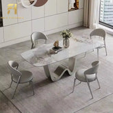 Modern dining set with a marble-like table and chairs in a stylish room.