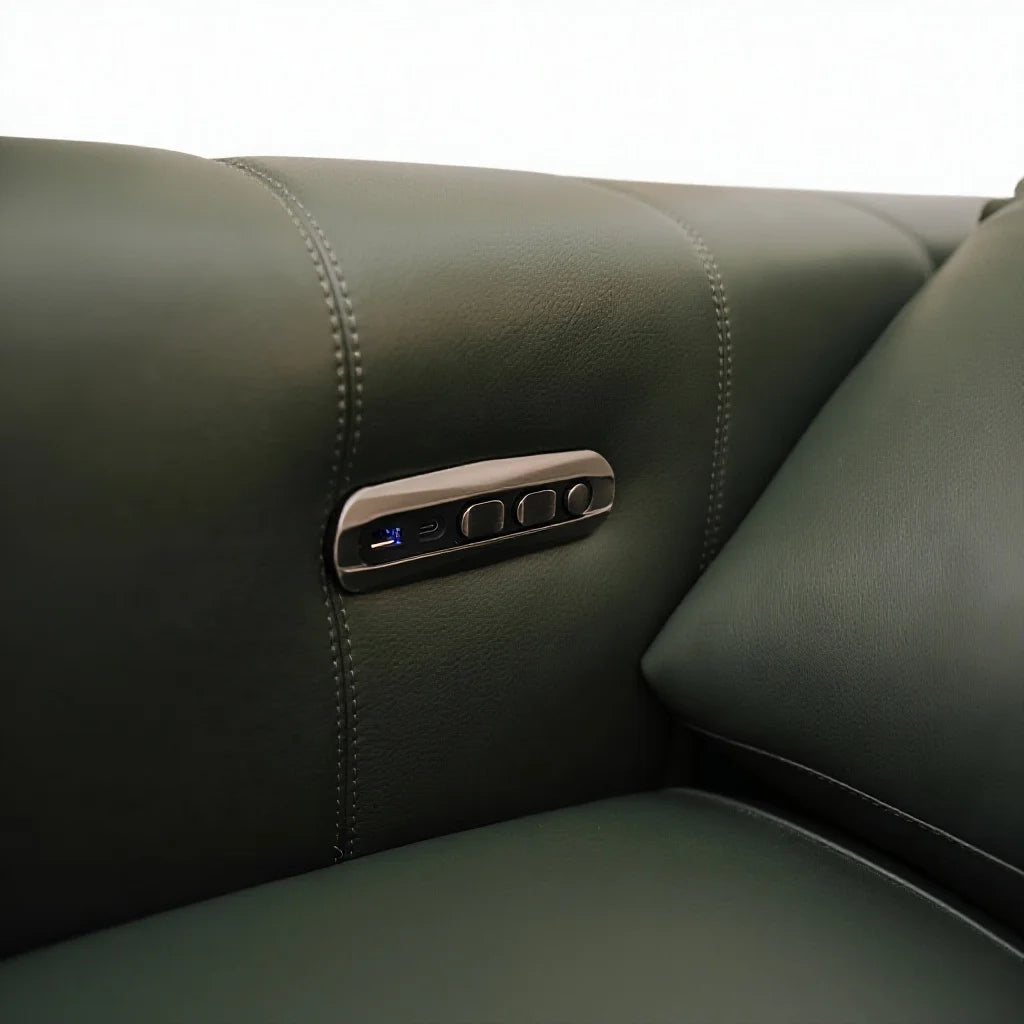 Close-up of a dark olive green leather seat with a built-in control panel featuring buttons and a blue illuminated screen.