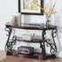 Decorative console table with ornate design in a room setting.