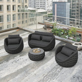 Outdoor furniture set on a rooftop with cityscape background