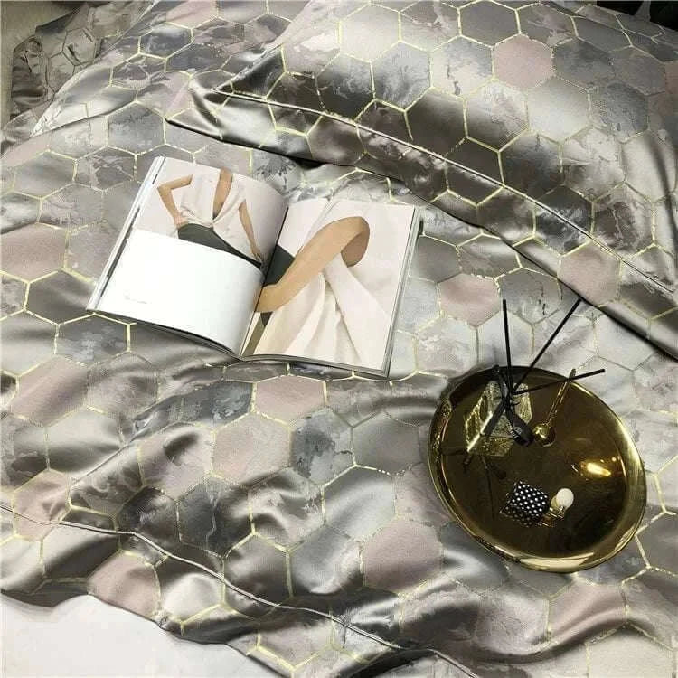 Luxury black and gold yarn-dyed jacquard bedding set made from premium Egyptian cotton with satin finish and intricate hexagonal pattern