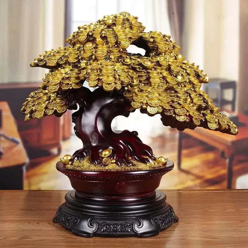 Decorative bonsai tree sculpture with gold coins on a wooden base