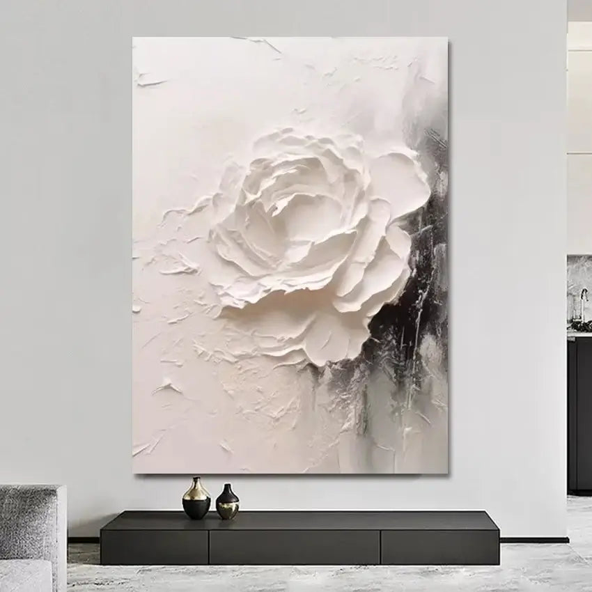 Abstract painting of a white flower on a gray background in a modern interior setting.