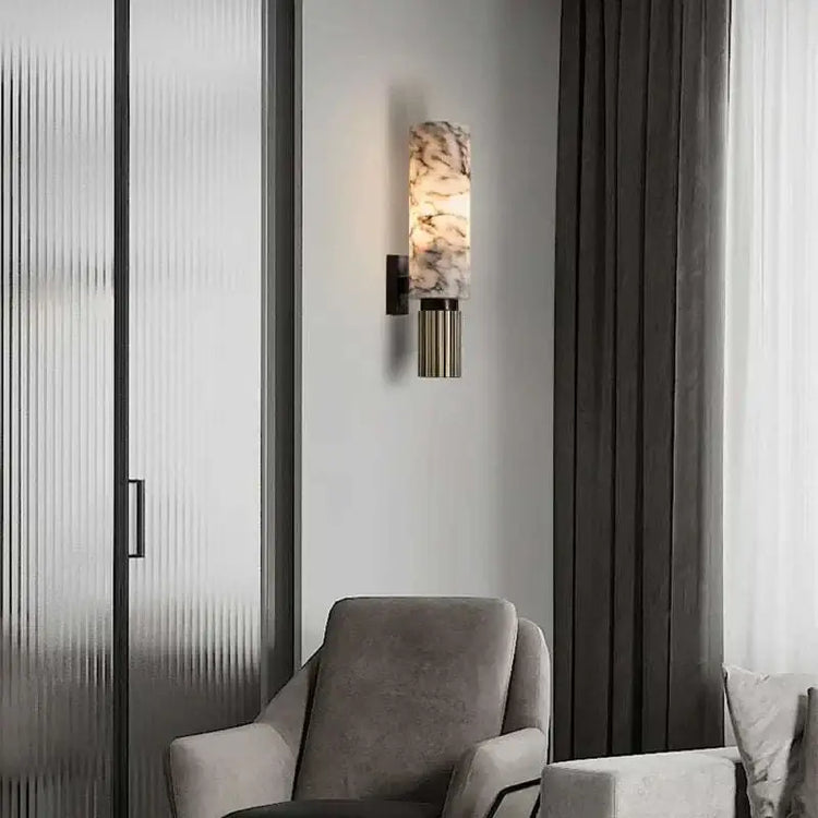 Modern marble wall lamp illuminating a stylish interior space with elegant decor.