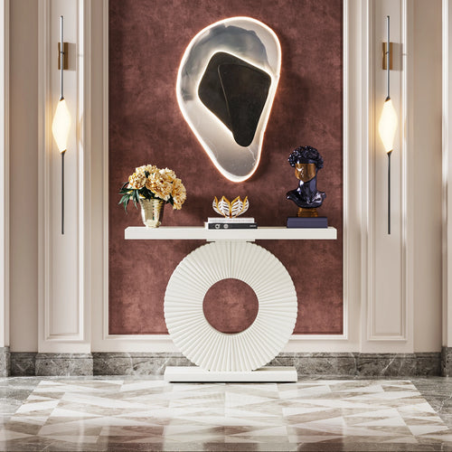 Decorative console table with a unique wall mirror in a stylish interior setting.