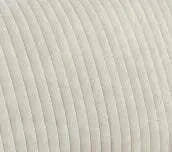 Close-up of a textured beige fabric surface