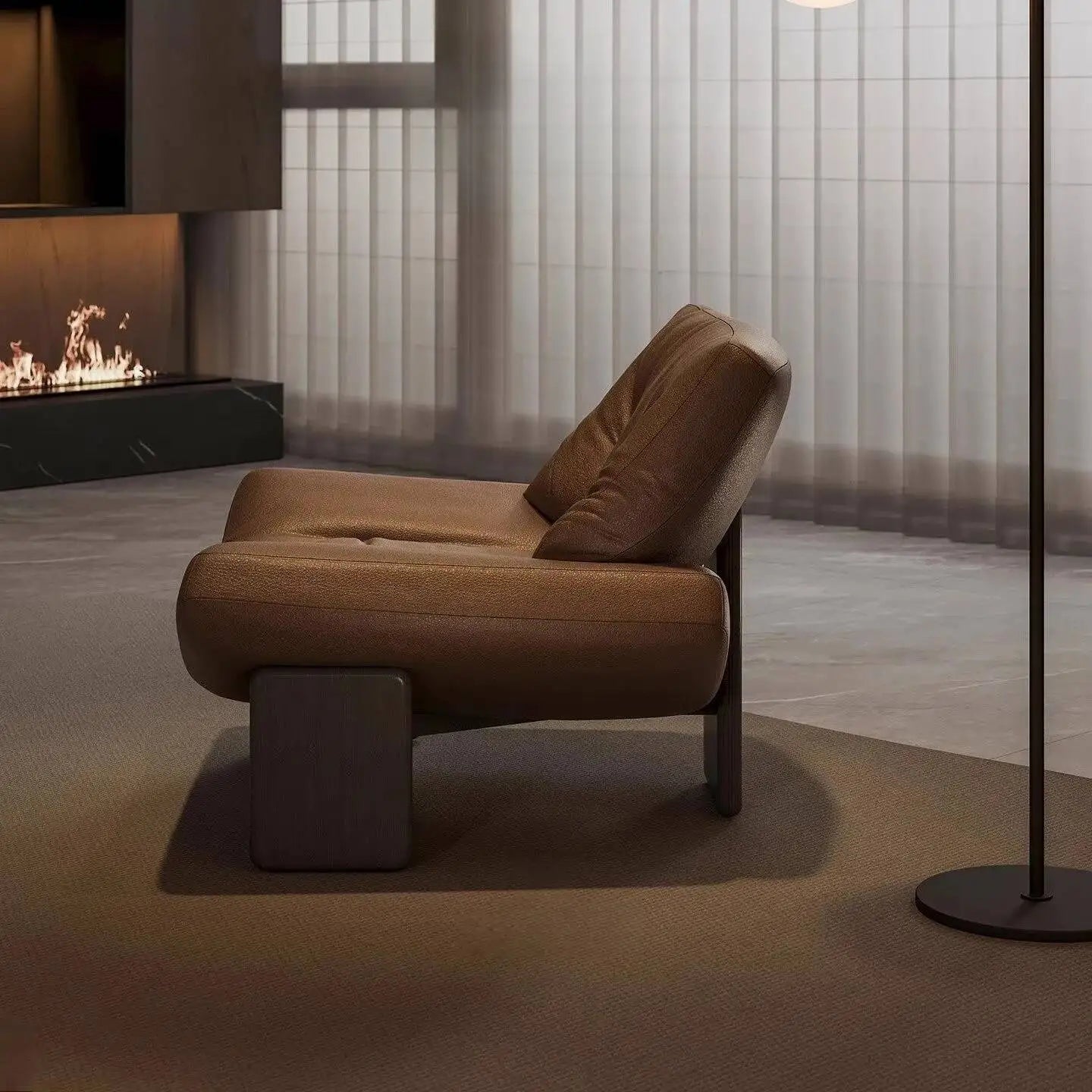 Italian leather single seater sofa chair in a modern living room setting with a cozy fireplace.