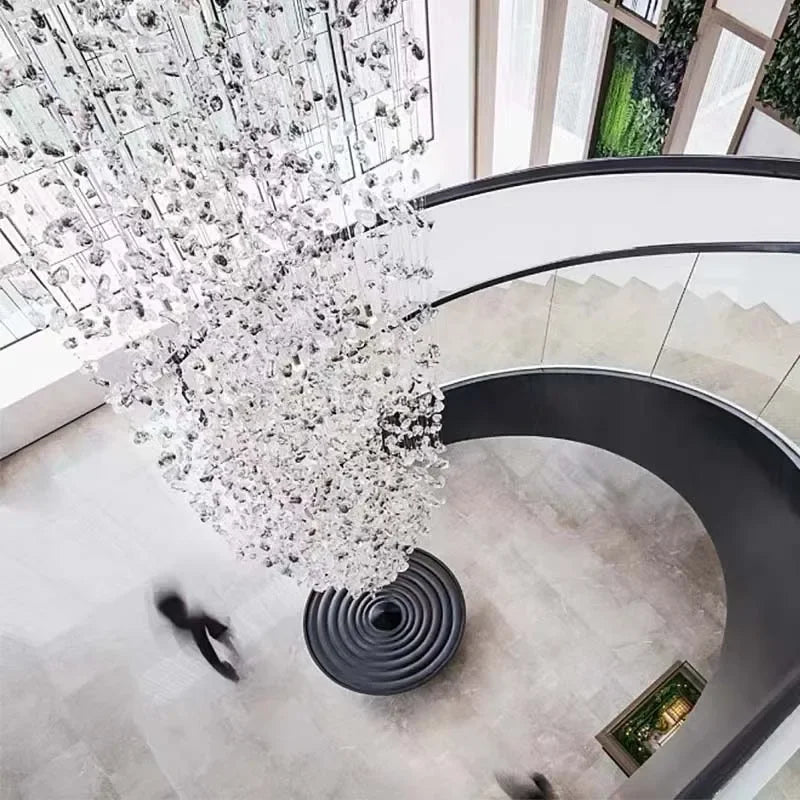 luxury crystal stone chandelier elegantly illuminating a modern staircase with stunning design and LED lighting.
