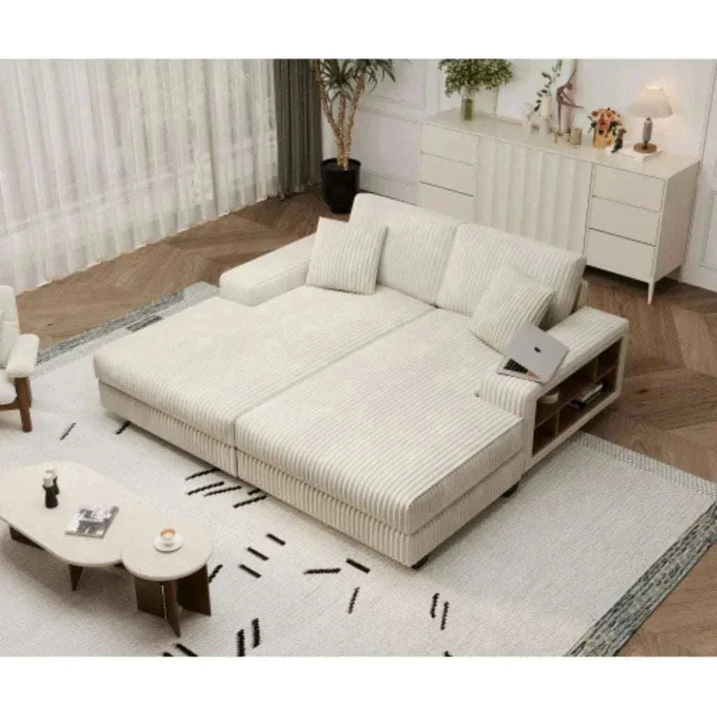 Beige sectional sofa in a living room setting with a rug and coffee table.