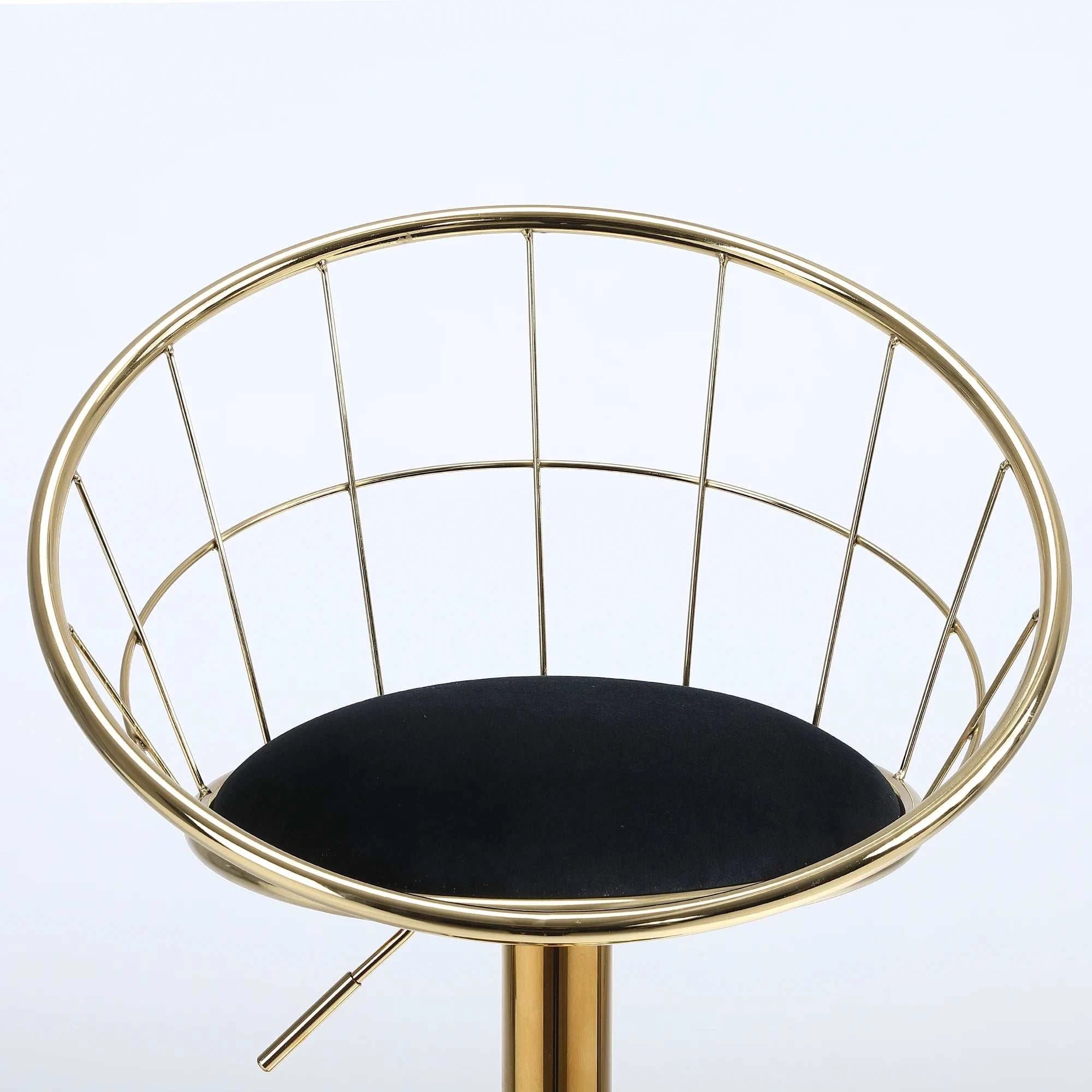 Gold wireframe chair with a black cushion on a white background