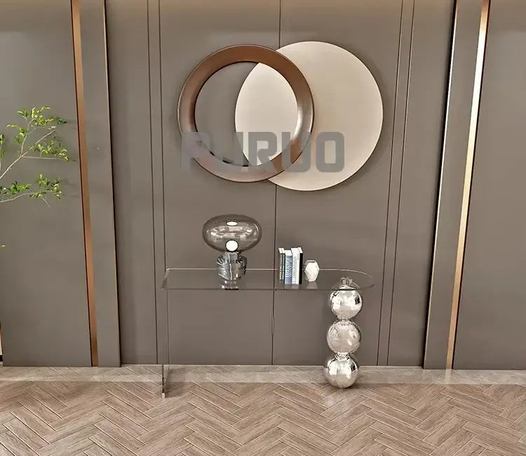 Decorative wall with round mirrors and glass shelves against a brown paneled wall.