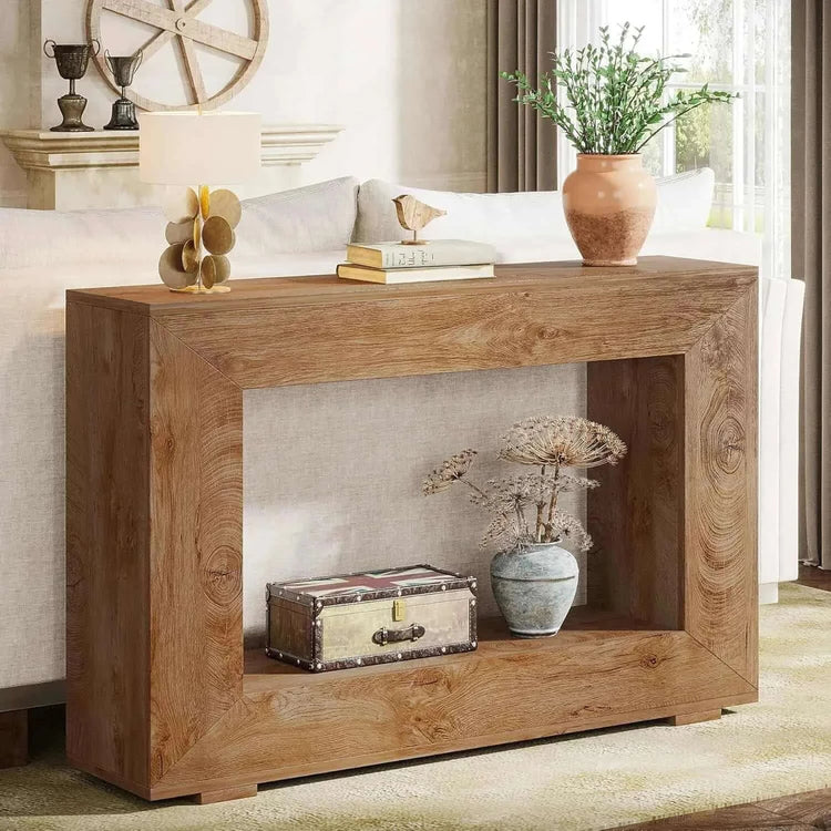 Wooden console table with decorative items in a living room setting