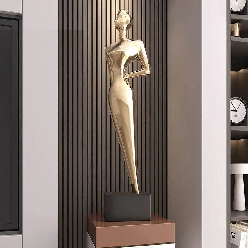 Italian minimalist figure sculpture in polished metallic resin on a black base, displayed as a large luxury entrance ornament