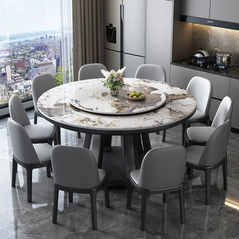 Round dining table with marble-like surface in a modern kitchen setting