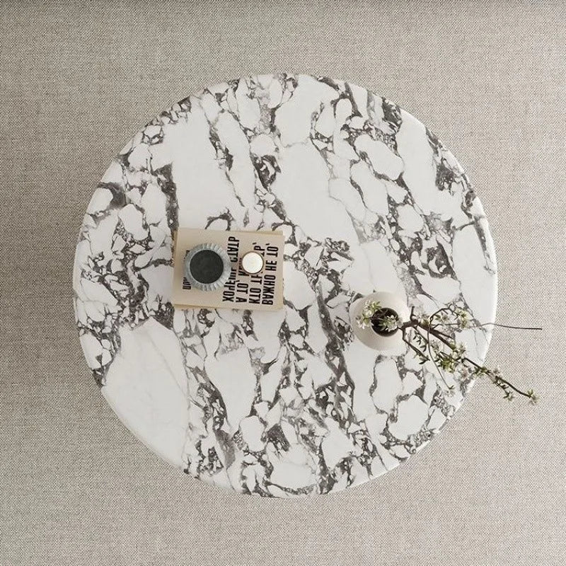 Marble-patterned record with a label on a textured surface