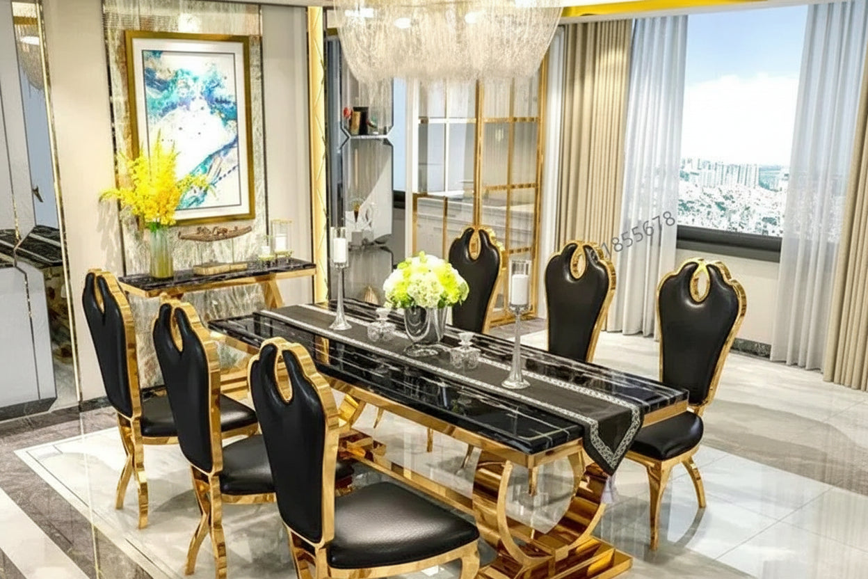 Dining table set with black chairs and gold accents in a modern room.