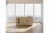Modern living room display cabinet with elegant design, featuring light colors and spacious storage, placed by large windows.