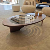 Modern coffee table with glass top in a living room setting