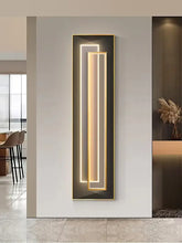 Modern LED mural light for modern decor in sleek vertical design, enhancing art and ambiance in stylish interior.