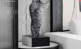 Decorative sculpture on a stand in an interior setting