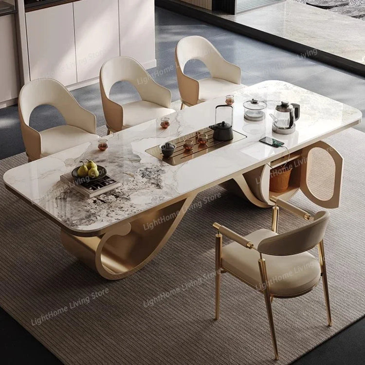 Modern dining table with marble surface and four matching chairs in a stylish room.