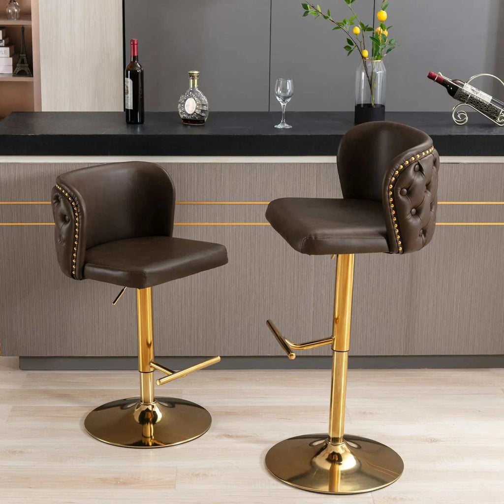 Two brown bar stools with gold legs in a kitchen setting.